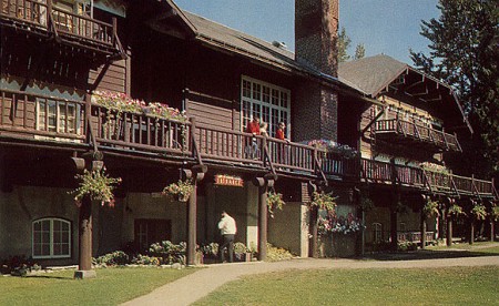 entrance sign over the ersatz front door at the lake mcdonald lodge
